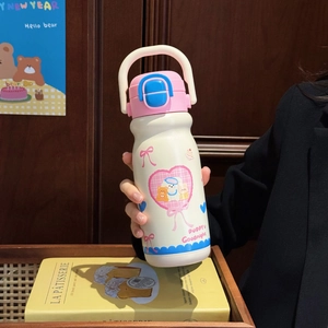 Close-up of cute dog pattern vacuum flask with pink lid and blue handle strap