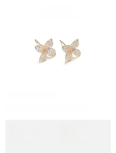 Detail view of tulip flower earrings with AAA cubic zirconia in gold plated brass