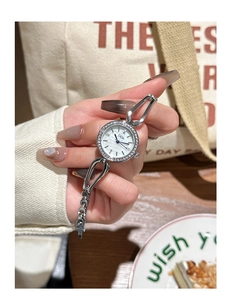 Close-up of GEDI silver bracelet watch with rhinestone bezel and mother of pearl dial