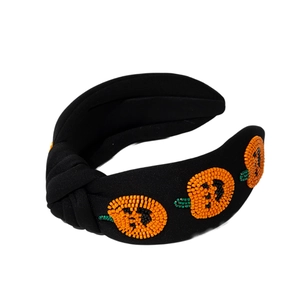 Handmade beaded pumpkin Halloween headband with orange beads on black fabric wide band