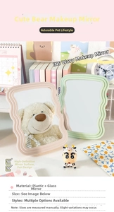 Detail of wavy plastic desktop makeup mirror in soft pink and mint green finishes