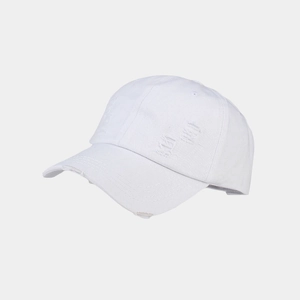 Close-up of white washed cotton baseball cap with distressed ripped details and frayed brim