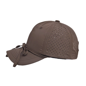 Detail of dark brown quick-dry baseball cap featuring breathable perforated side and bow