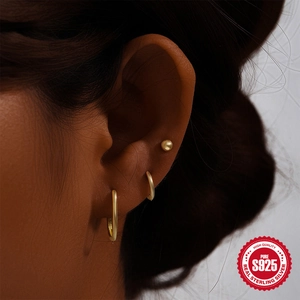 3-piece S925 sterling silver turquoise gold earring set shown on model ear