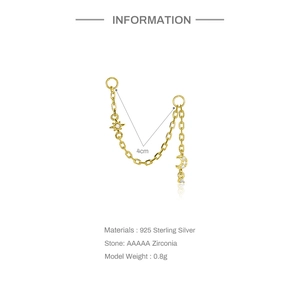 Close-up of 925 sterling silver gold chain earring with star and moon zircon charms