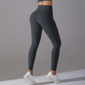Detail of dark grey high-waisted yoga pants showing the seamless butt-lifting effect
