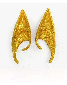 Close-up of golden glitter latex elf ears for Halloween party and cosplay costumes