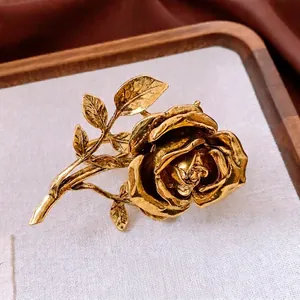 Vintage gold rose flower double finger ring with intricate layered petals and leaf design