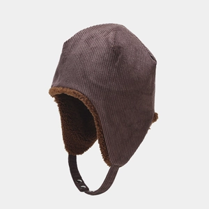 Detail of winter corduroy trapper hat with warm faux lamb wool lining and chin strap