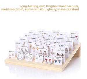 Three-tier solid wood earring display stand with slots for fashion jewelry cards
