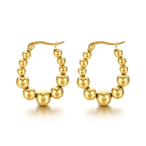 Polished gold U-shaped geometric hoop earrings with graduated metal beads on white background