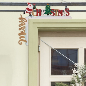 Detailed view of a wooden Merry Christmas door corner ornament with Santa and tree motifs