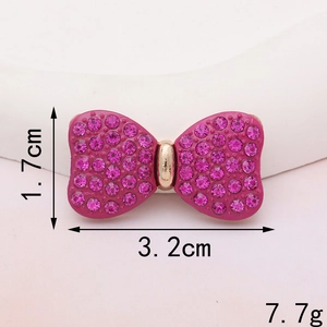 Detailed view of rose red rhinestone bow charms showing 3.2cm width and 1.7cm height