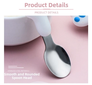 Macro detail of round smooth stainless steel spoon head with cute blue cat paw handle