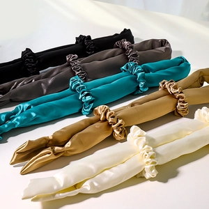 Satin heatless hair curlers with matching scrunchies in assorted silk-textured colors