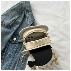 Mini crossbody bag with cartoon ears showing internal capacity and metal chain strap