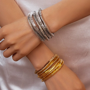 Stacked geometric metal textured bangles in gold and silver finish for women