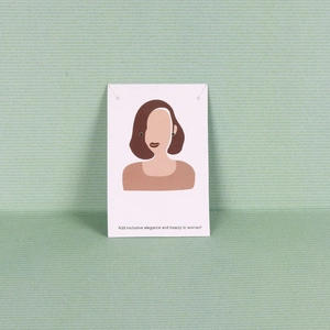 Elegant white jewelry display card for earrings with artistic female illustration and text