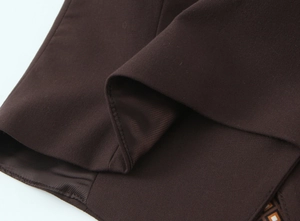 Detailed macro view of dark brown woven fabric texture and premium inner lining craftsmanship