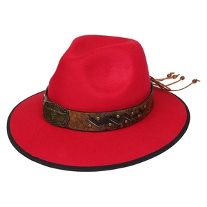 Detail of red fedora hat featuring brown leather band with bronze bull head buckle and studs