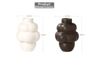 Detail view of modern bubble ceramic vases in matte white and bronze with dimensions