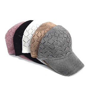 Close-up of mesh knit baseball caps showing texture and five different color options