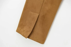 Close-up of high-quality camel faux suede fabric texture and neat stitching details