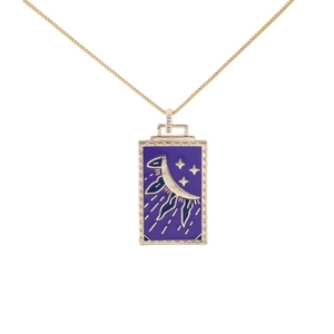 Gold tarot card pendant necklace with moon and star enamel details on white background