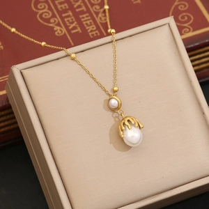 Elegant gold double layer necklace with fluid metal accents and irregular faux pearls