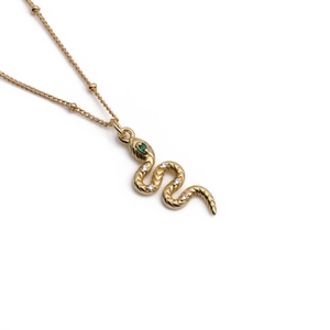 Elegant gold snake pendant necklace with green gemstone head and white zircon accents