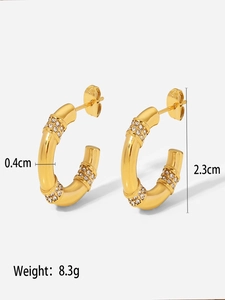 Detailed view of bamboo-style gold stud earrings with dimensions 0.4cm width and 2.3cm height