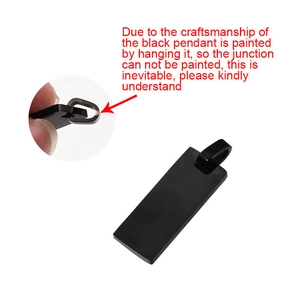 Detail showing the painting process for the black rectangular stainless steel pendant