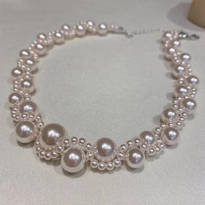 Elegant layered pearl necklace with multi-strand design and silver adjustable clasp