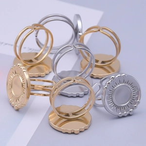 Detailed macro view of 304 stainless steel adjustable sunburst disc rings in gold and silver