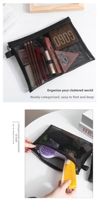Close-up of portable black mesh makeup bag showing translucent storage for cosmetics