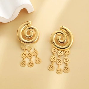Detailed macro view of 18k gold-plated layered leaf tassel earrings with spiral motifs