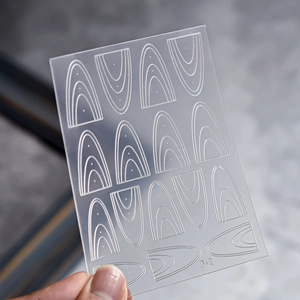 Hollow nail art stencil F-8 featuring nested arch line designs on a clear plastic sheet