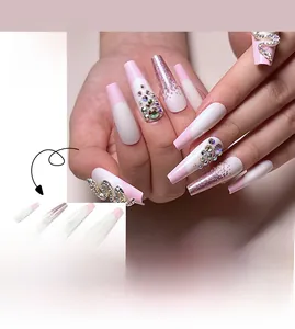 Detail of pink French press-on nails featuring glitter gradients and silver snake rhinestones