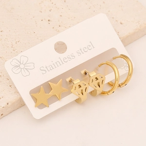 Detailed close-up of a 3-pair set of gold stainless steel star and hoop earrings
