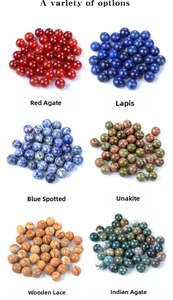 Detailed display of assorted natural gemstone round beads with polished finish and texture