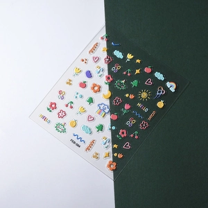 Close-up of 5D embossed kids nail stickers with cute 3D floral and rainbow patterns