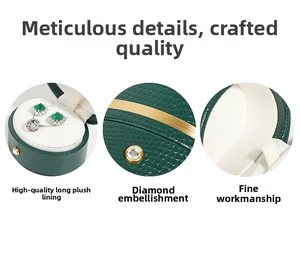 Detail of dark green PU leather jewelry box with gold trim and crystal clasp decoration