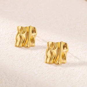 Minimalist 18K gold plated stainless steel square wavy earrings on beige fabric