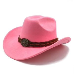 Close-up of pink suede cowboy hat with a brown braided band and bronze star badge