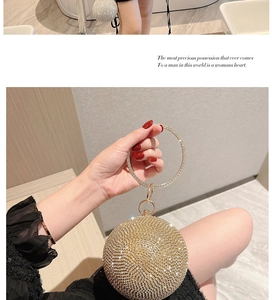 Macro shot of gold rhinestone evening bag with round crystal handle for parties