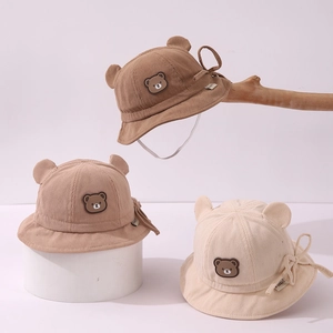 Corduroy baby bucket hat with cute bear ears and windproof strap in warm autumn colors