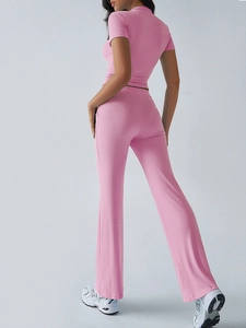 Rear view of a pink two-piece set featuring a short sleeve top and wide leg pants
