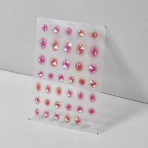 Embossed Japanese nail stickers featuring pink blush nebula and white cloud patterns