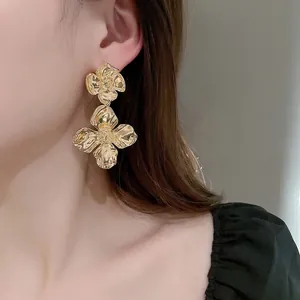 Elegant gold flower layered drop earrings featuring a bold metallic petal design for women