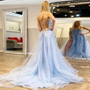 Light blue lace formal evening gown with open back lace-up detail and high side slit
